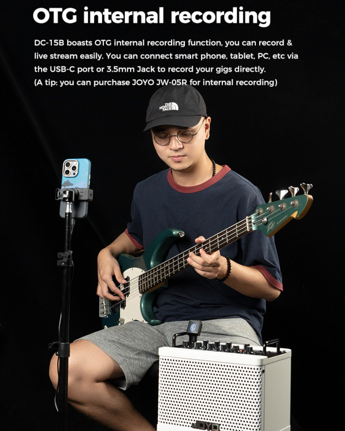 Haze Guitar Australia musician playing a bass guitar with a Joyo DC15B portable digital amplifier and phone mount